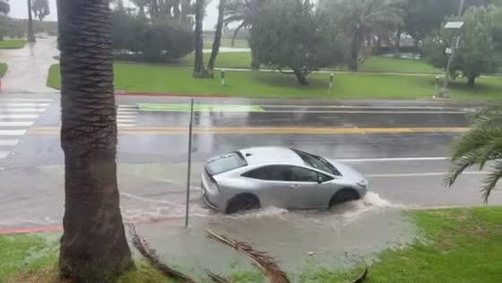 Heavy rainfall triggers street flooding on Ocean Avenue in California, USA