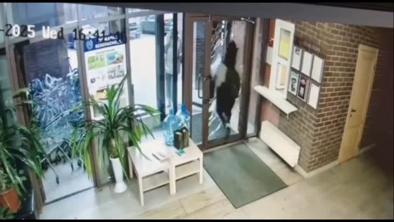 Man crashes through glass door in Khimki, Moscow, Russia