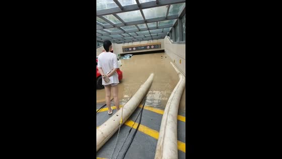 Flash flooding submerges underground parking garage in Zhejiang, China