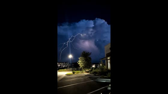 Powerful supercell thunderstorm glows with lightning over Santa Rosa Beach, USA
