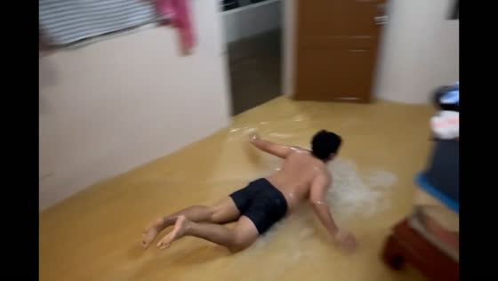 Young man plays in floodwaters caused by tropical storm in Cainta