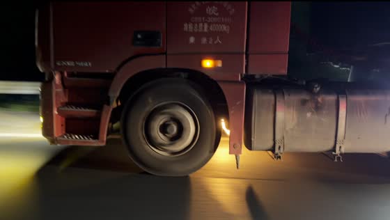 Sparks and flames erupt beneath moving truck on highway in Jiangsu, China