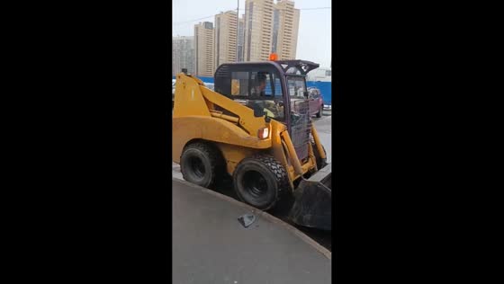 Mini-tractor damages multiple cars in yard area of Parnas in Saint Petersburg, Russia