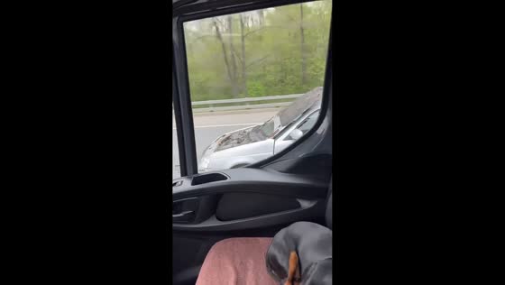 Car drives with front hood blocking windshield in Moscow, Russia