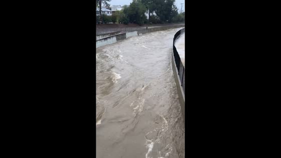 LA River surges during Pineapple Express storm in California, USA
