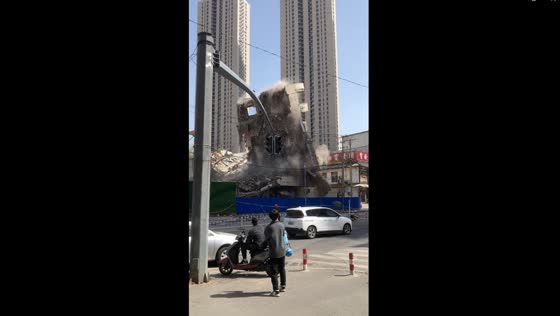 Spectacular controlled demolition: astonishing video captures building's graceful collapse in Shenyang, China