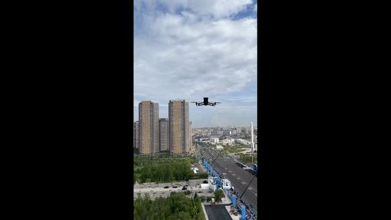 Drone warns woman filming military parade from window in Astana, Kazakhstan