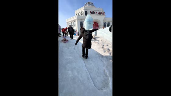 Man nearly slips but regains balance while walking on icy snow path in Hebei, China