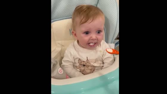 Baby reacts to first taste of cottage cheese in Penza, Russia