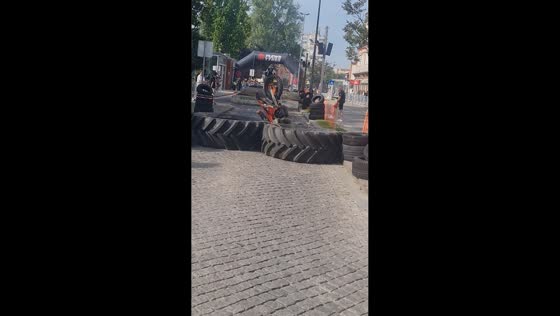 Rider loses balance on giant tire obstacle at Hard Enduro event in Penafiel, Porto, Portugal