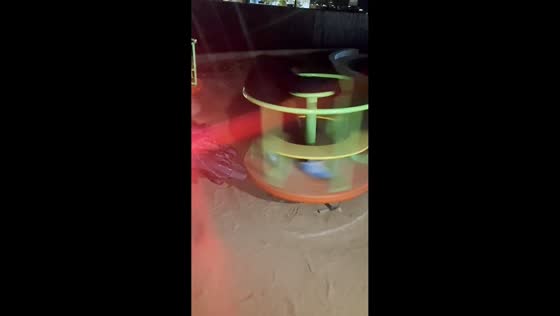 Friend spins wildly on playground carousel in Hebei, China