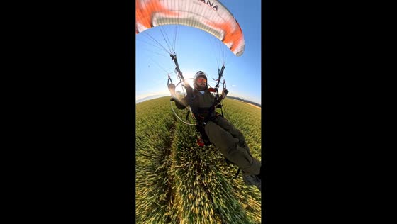 Powered paraglider makes safe emergency landing over grain field in Lipowa, Poland