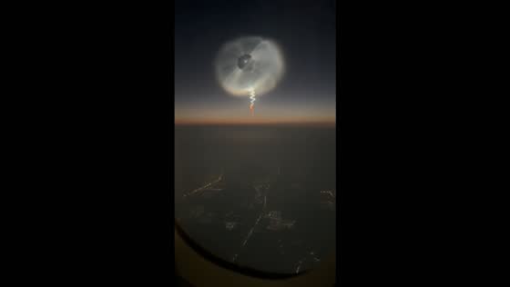 Rocket launch creates a glowing space jellyfish in the sky over Beijing, China