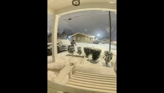 Security camera captures man slipping on snowy ground in Augusta, Georgia, USA
