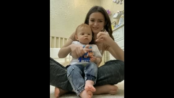 Mom and child and suddenly the baby took his first steps