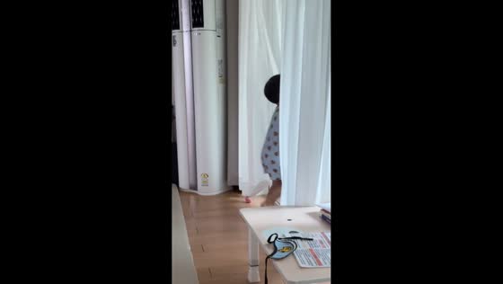 Little boy bumps head on sliding glass door in Seoul, South Korea