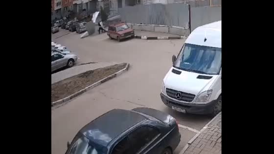Metal fence topples onto a passerby in Balashikha, Russia, during wind gust