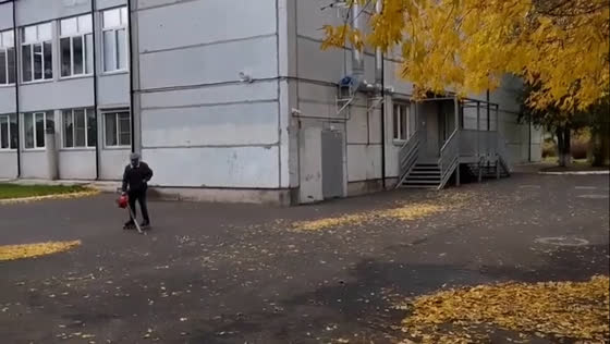 Janitor rollerblades while cleaning school yard in Krasnoyarsk