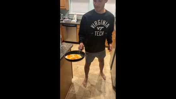 Funny kitchen fail flipping eggs in Panama City, Florida, USA