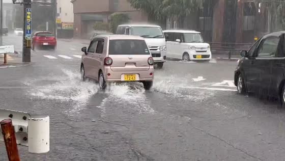 Heavy rain floods road near Kanazawa Izumino Library in Ishikawa, Japan