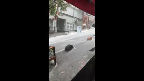 Floodwaters send debris rushing down steep street in Istanbul, Turkey