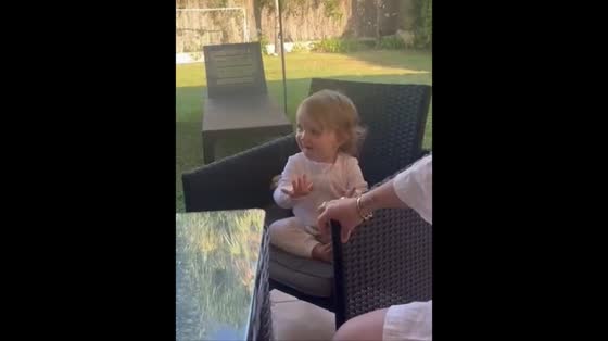 Little girl joyfully dances to Bob Marley in Sotogrande, Spain