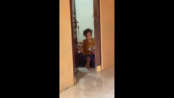 Toddler stands silently in Yogyakarta, Indonesia