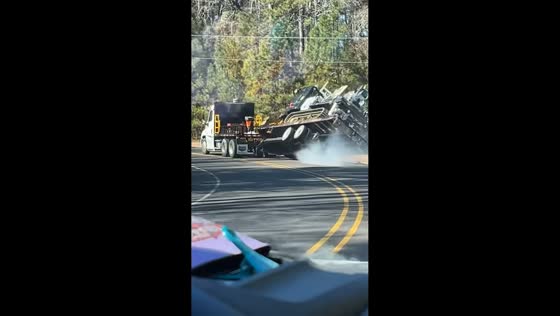 Heavy-duty trailer overturns while hauling oversized load in El Dorado, Arkansas, USA,