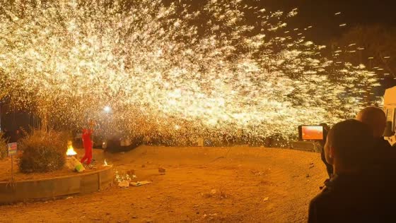 Molten iron sparks startle crowd during Da Shuhua performance in Hebei, China
