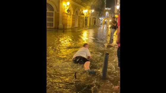 Man falls in flooded area in Cartagena, Colombia