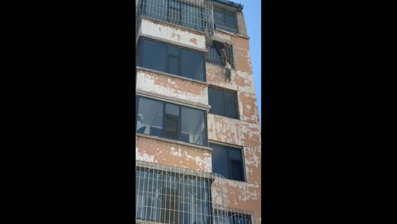 Dramatic rescue saves child hanging from sixth-floor window in Shanxi, China