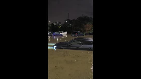 Deep floodwaters submerge vehicles in L'Hospitalet de Llobregat, Spain
