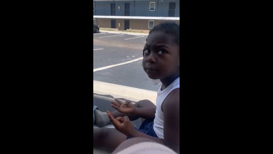 Mother helps son solve math problem in Lake Wales, Florida