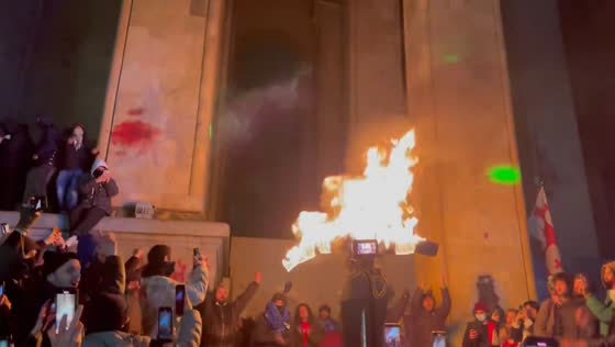 Protesters set alight effigy in front of Georgian Parliament in Tbilisi