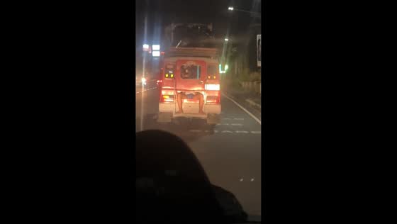 Man caught sleeping with feet outside in jeep in Manila, Philippines