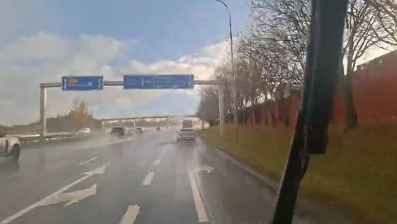 Rain and bright sunshine create unusual driving conditions in Reykjavík, Iceland