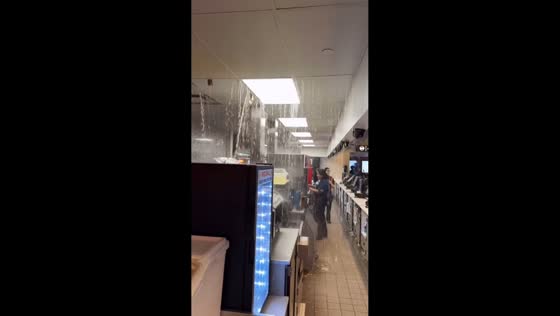 Heavy rain causes ceiling leak inside Brooklyn movie theater in New York, USA