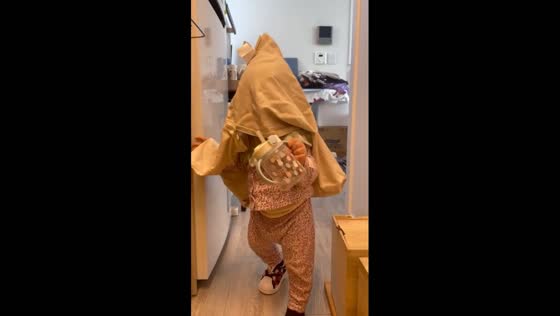 Seoul stroll: toddler takes playful pillowcase walk
