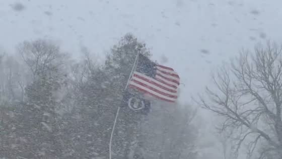 Sudden snow squall blankets quiet roads in New York, USA