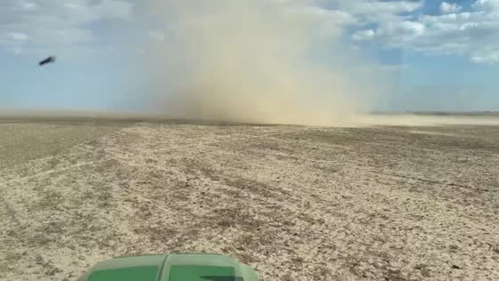 Dust devil swirls across dry farmland as weather shifts in Kansas, USA