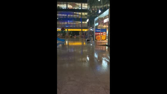 Man slides past landing and into building on rainy day in Shandong, China