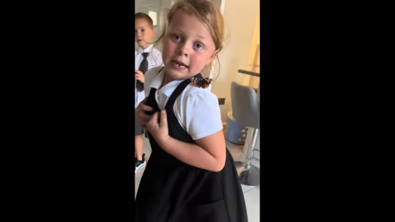 Little girl panics as butterfly climbs her shoulder in Manchester, England, UK
