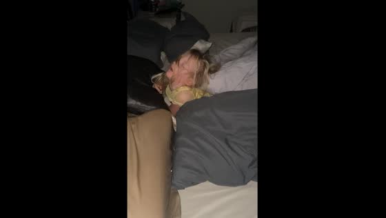Child sleeps with head tilted back in Phoenix, Arizona