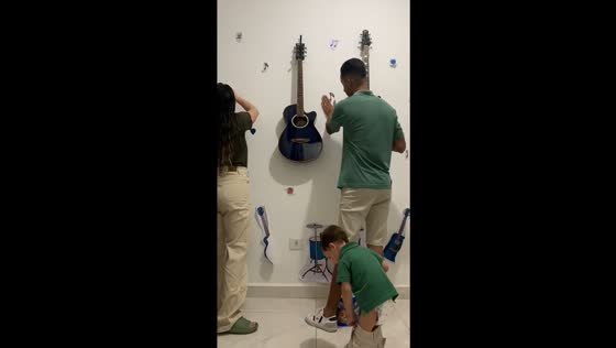 Parents realize son struggling with pants while decorating the house