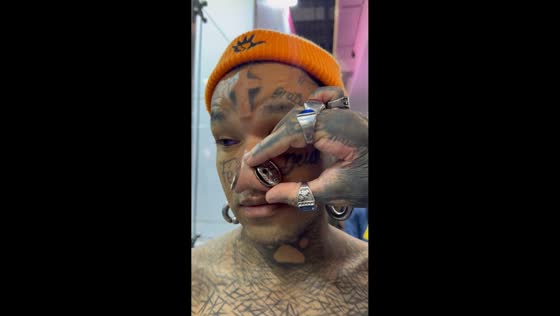 Heavily tattooed men showcase extreme body modifications in São Paulo, Brazil