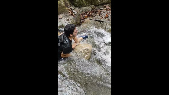 Rocky waterfall challenge: triumph amidst slip and fall