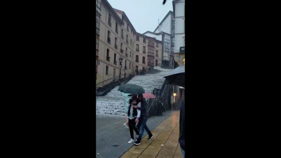 Torrential rain floods stepped streets during severe storm in Bilbao, Spain