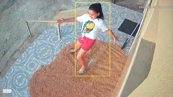 Girl slips on spilled beans outside home in Iguatu, Brazil