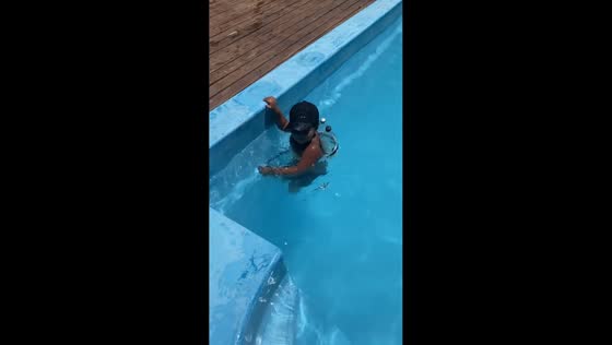 Nephew uses empty plastic bottles as pool floaters in Buenos Aires, Argentina