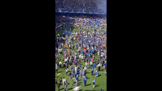 Fans storm pitch as Ipswich secure Premier League return in England, UK